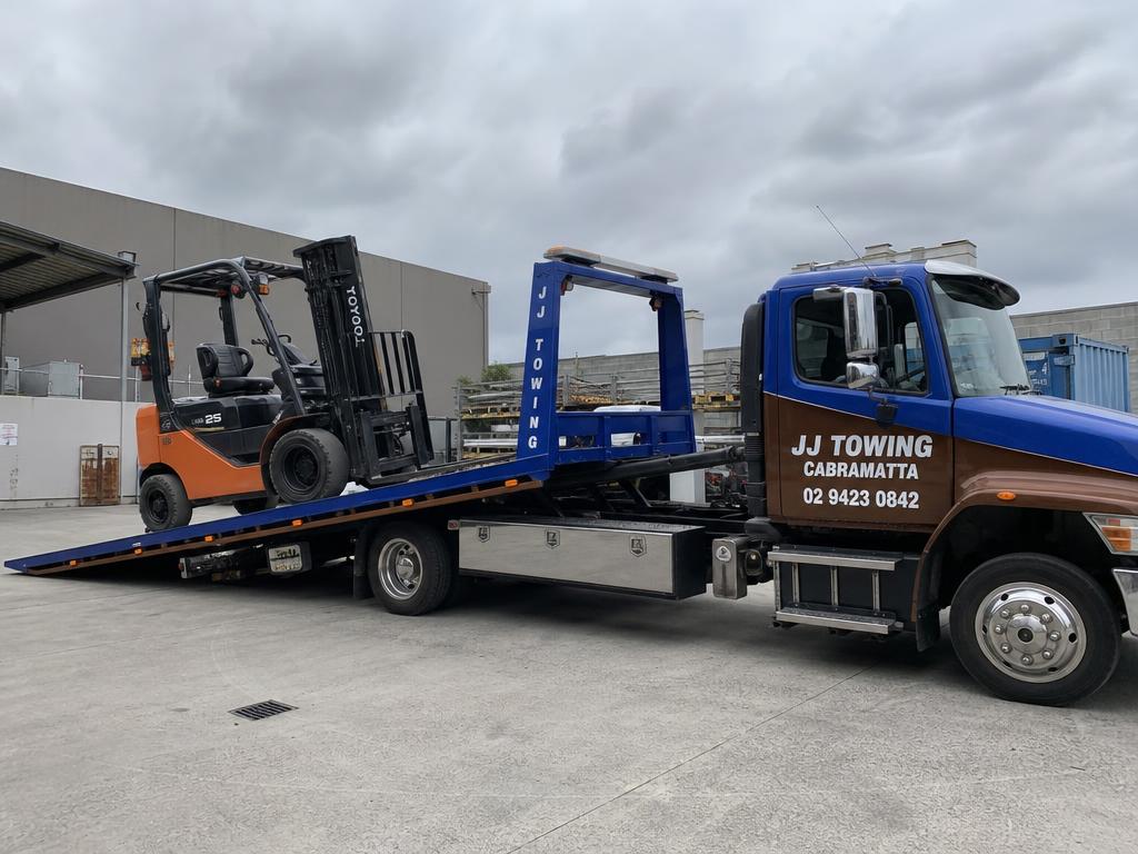 Forklift loaded onto a JJ Towing Cabramatta tow truck